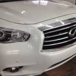 Three Infiniti vehicles (G37 coupe, G37 sedan, JX35) clear XPel paint protection film St. Charles